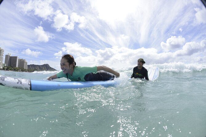 Semi-Private Surf Lesson for 2 or 3 people on Waikiki Beach - Land demo: the “get your feet under you” moment