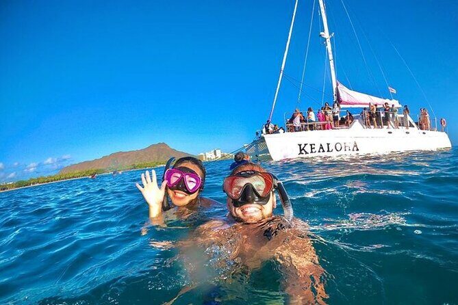 Sunset Boat Cruise: Swim and Cruise Waikiki - Sunset Over Waikiki Bay From a Pink Catamaran