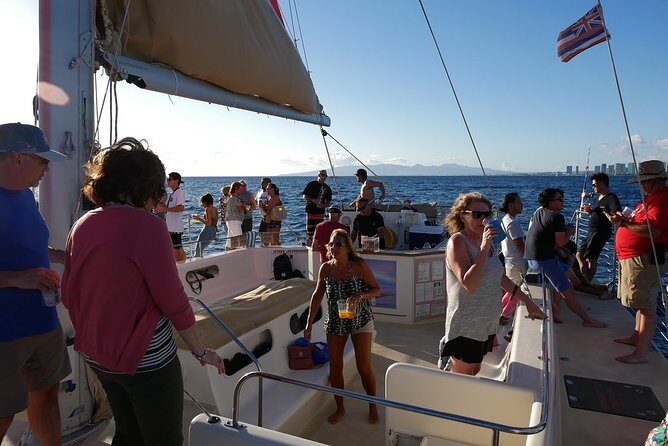Waikiki Sunset Cocktail Sail with Open Bar - Music, energy, and the social vibe onboard